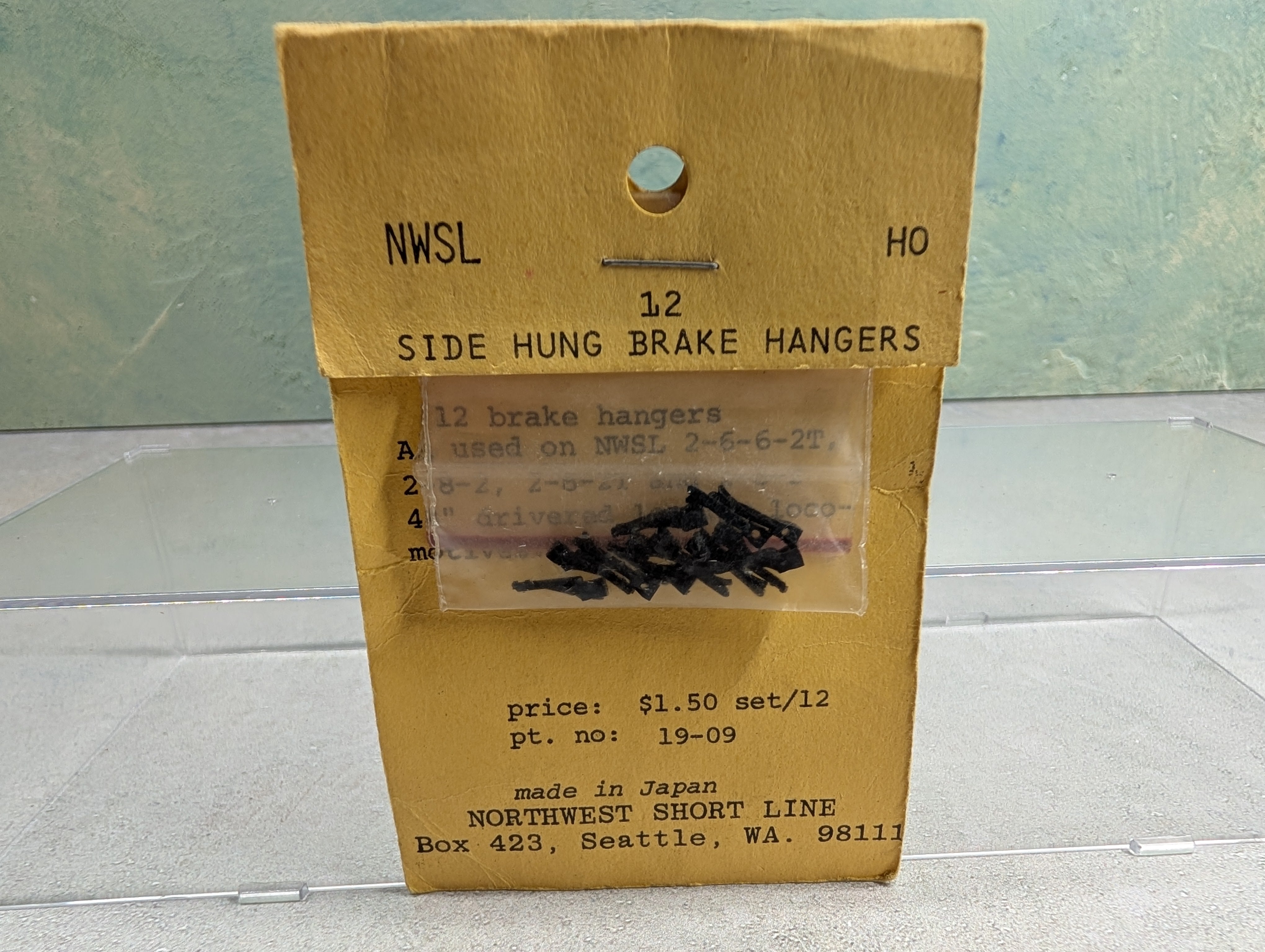 Northwest Short Line #19-09 HO Scale Side Hung Brake Hangers, Black Plastic (12 pcs)