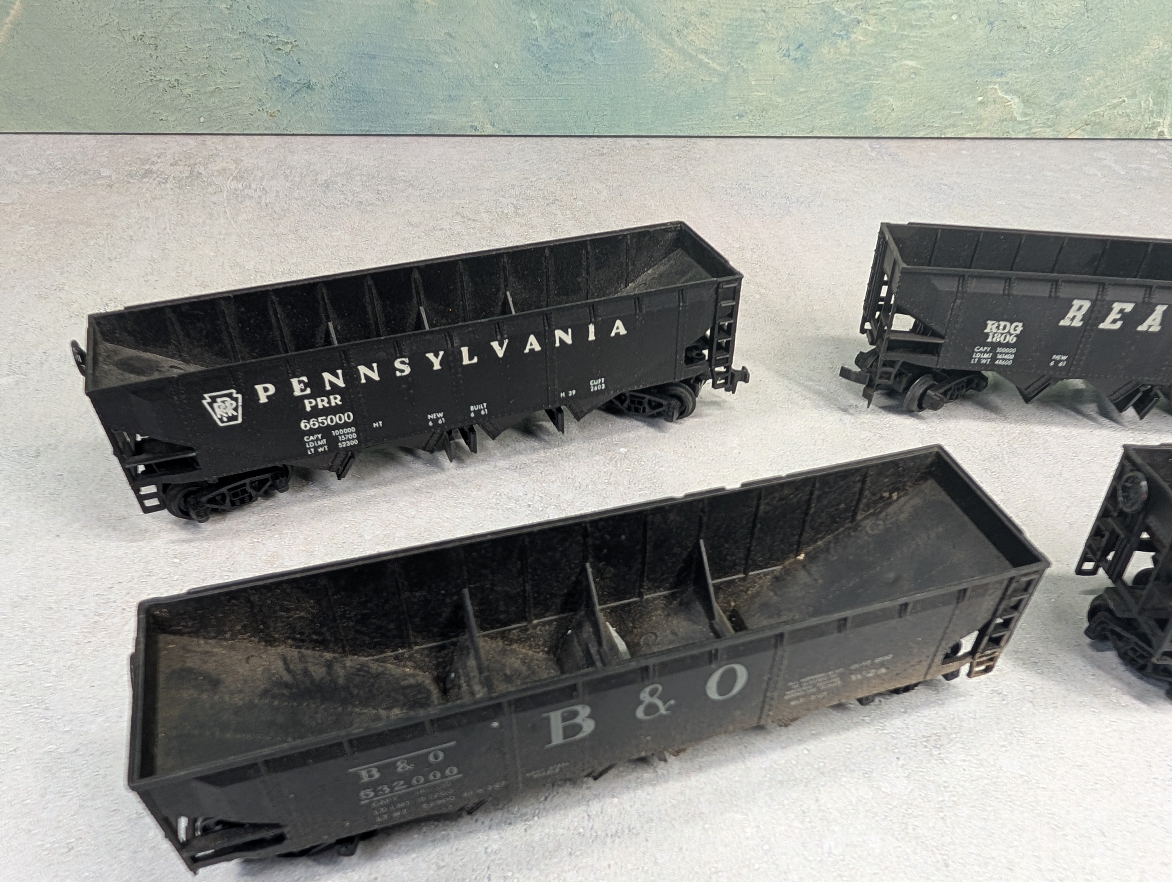 USED AHM HO Scale Lot of Operating Quad Hoppers Reading, B&O, PRR (4 pcs)