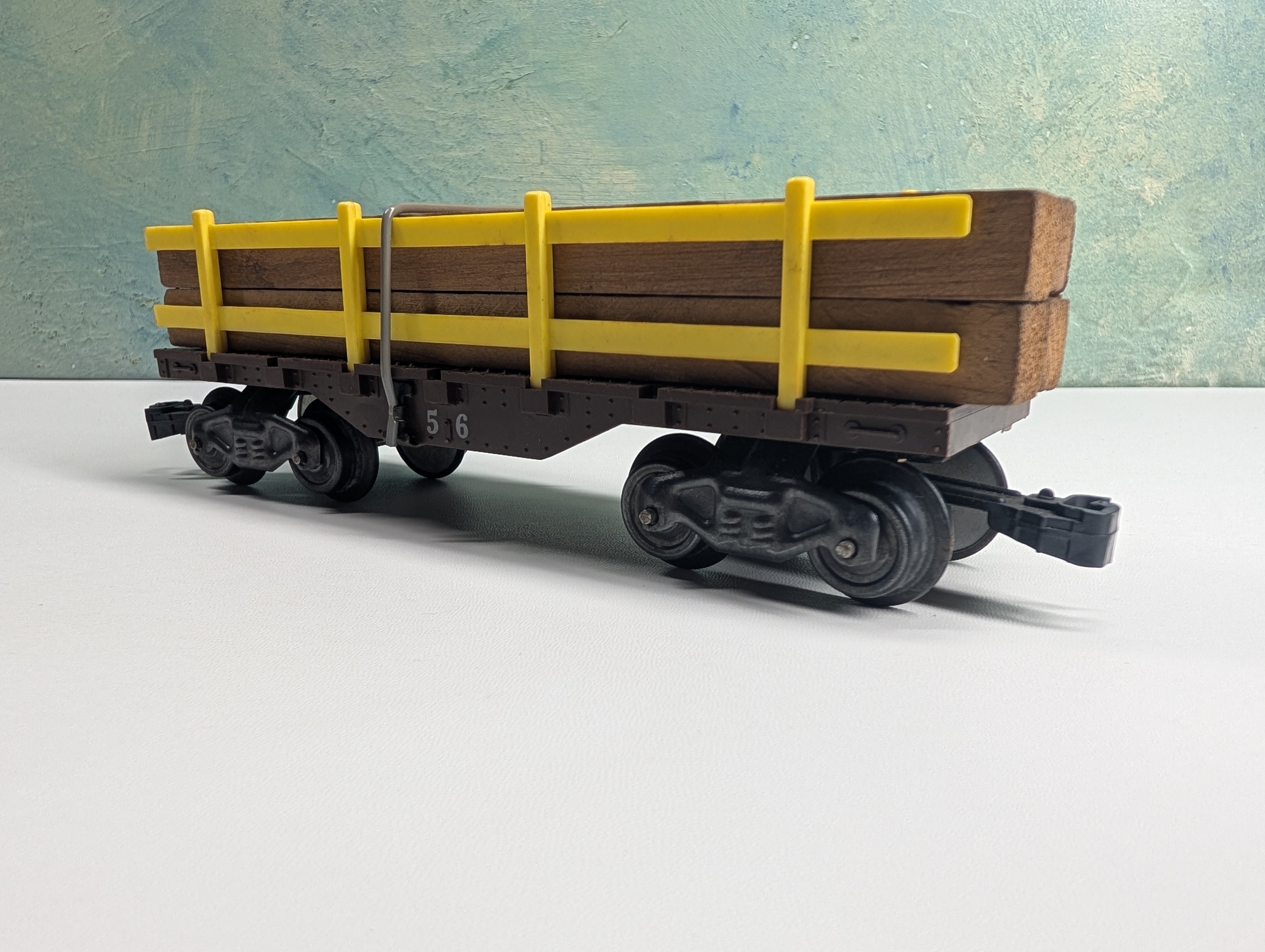 USED MARX O Flat Car w/ Lumber Load and Yellow Side Rails, William Crooks #56