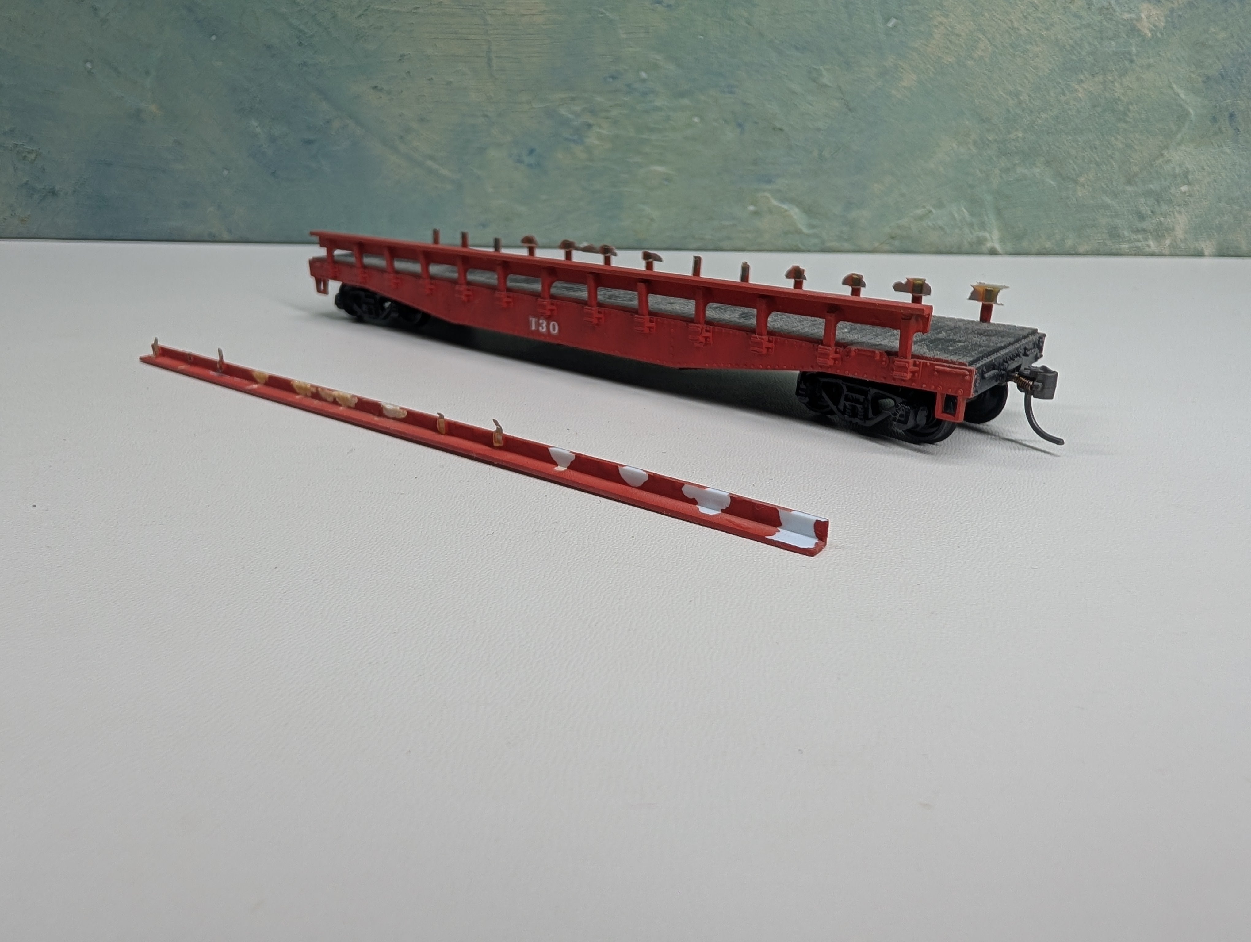 USED Athearn HO Scale Red 50' Flat Car w/ Stakes T30