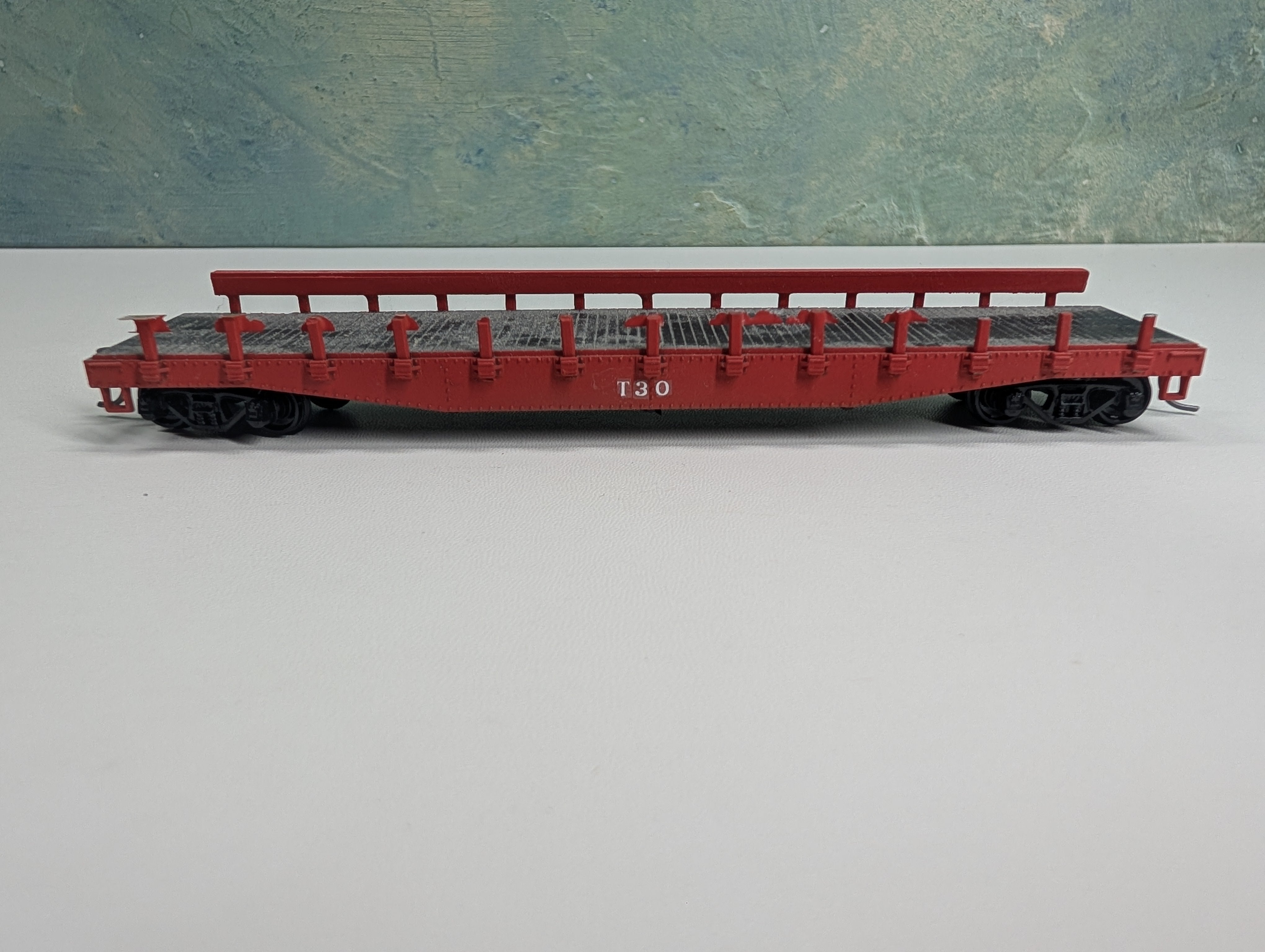 USED Athearn HO Scale Red 50' Flat Car w/ Stakes T30