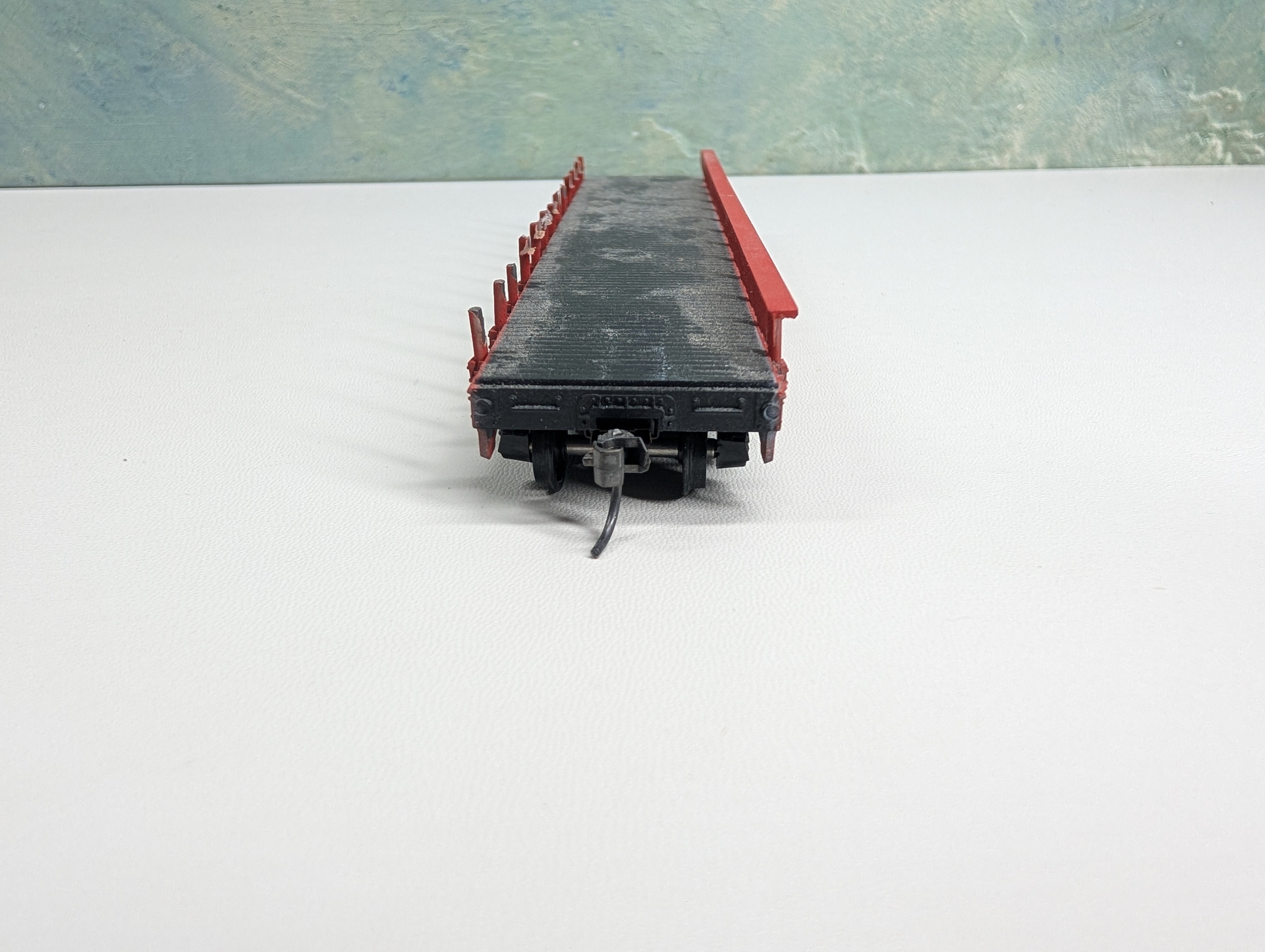 USED Athearn HO Scale Red 50' Flat Car w/ Stakes T30