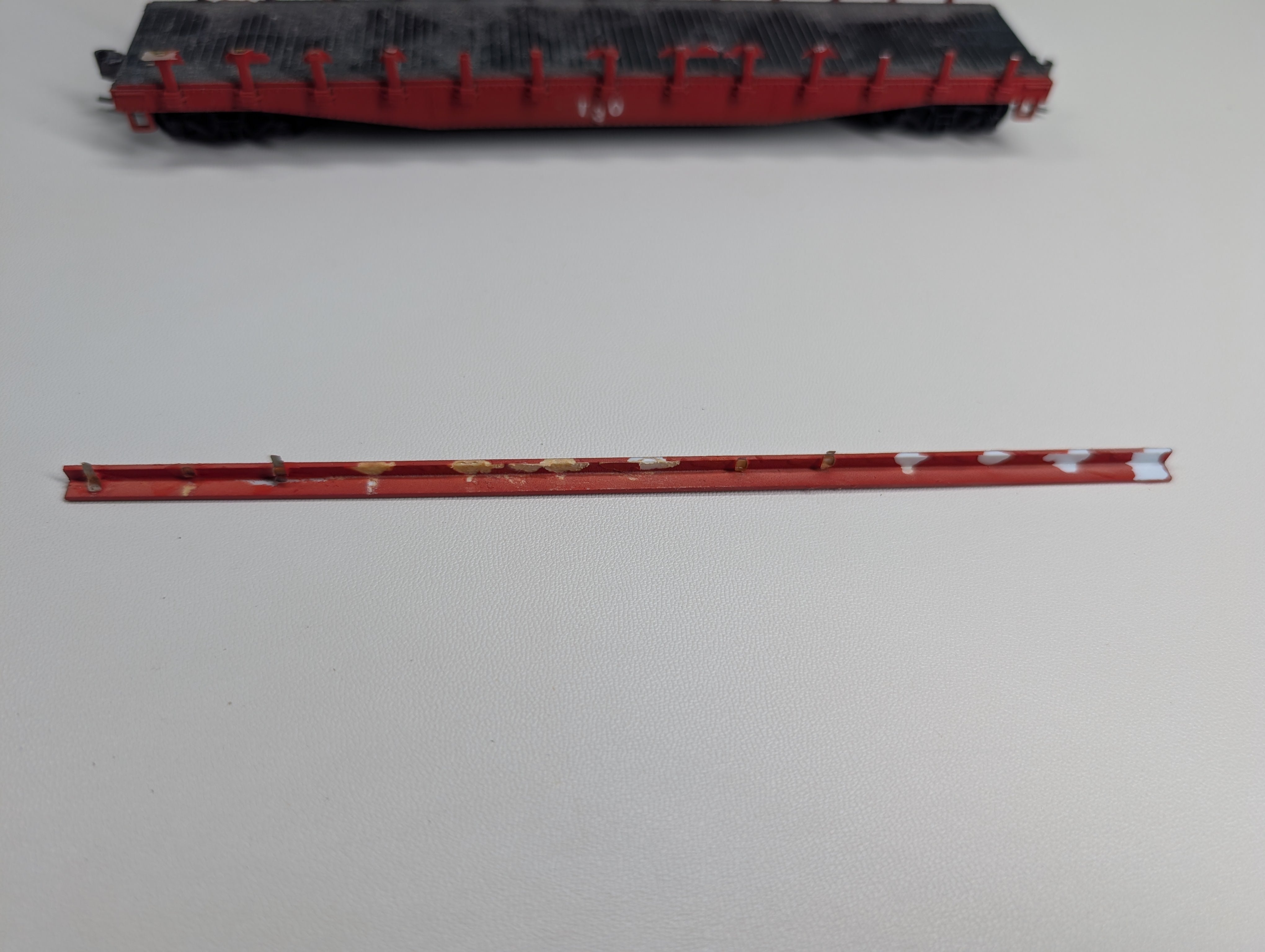 USED Athearn HO Scale Red 50' Flat Car w/ Stakes T30
