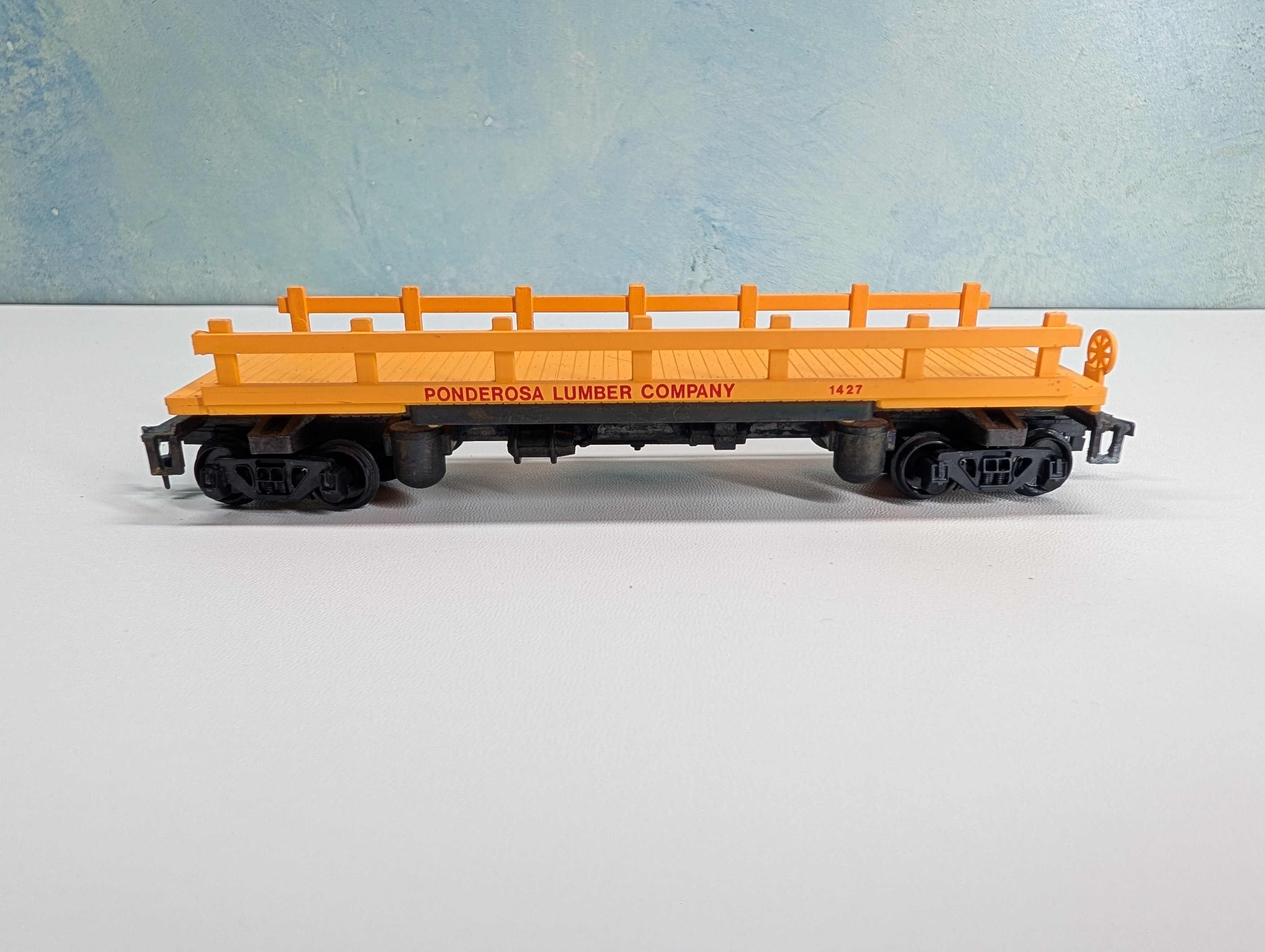 USED Bachmann HO Scale Log Dump Car Ponderosa Lumber Co #1427