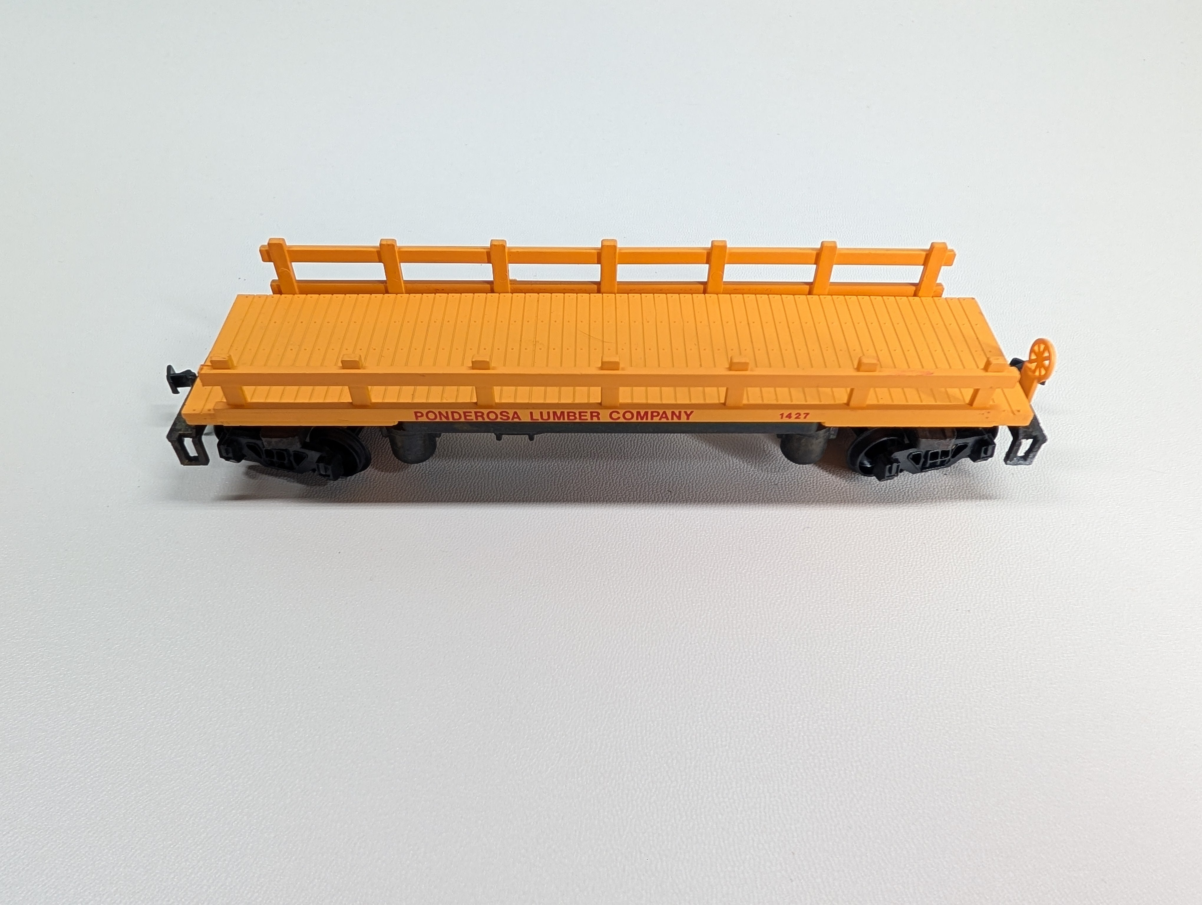 USED Bachmann HO Scale Log Dump Car Ponderosa Lumber Co #1427