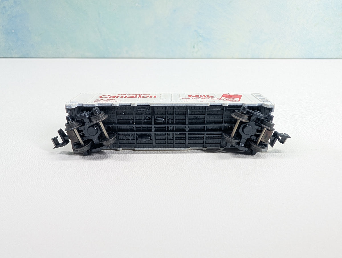 USED Postage Stamp Trains Aurora N Scale Box Car Carnation Milk CM #25063