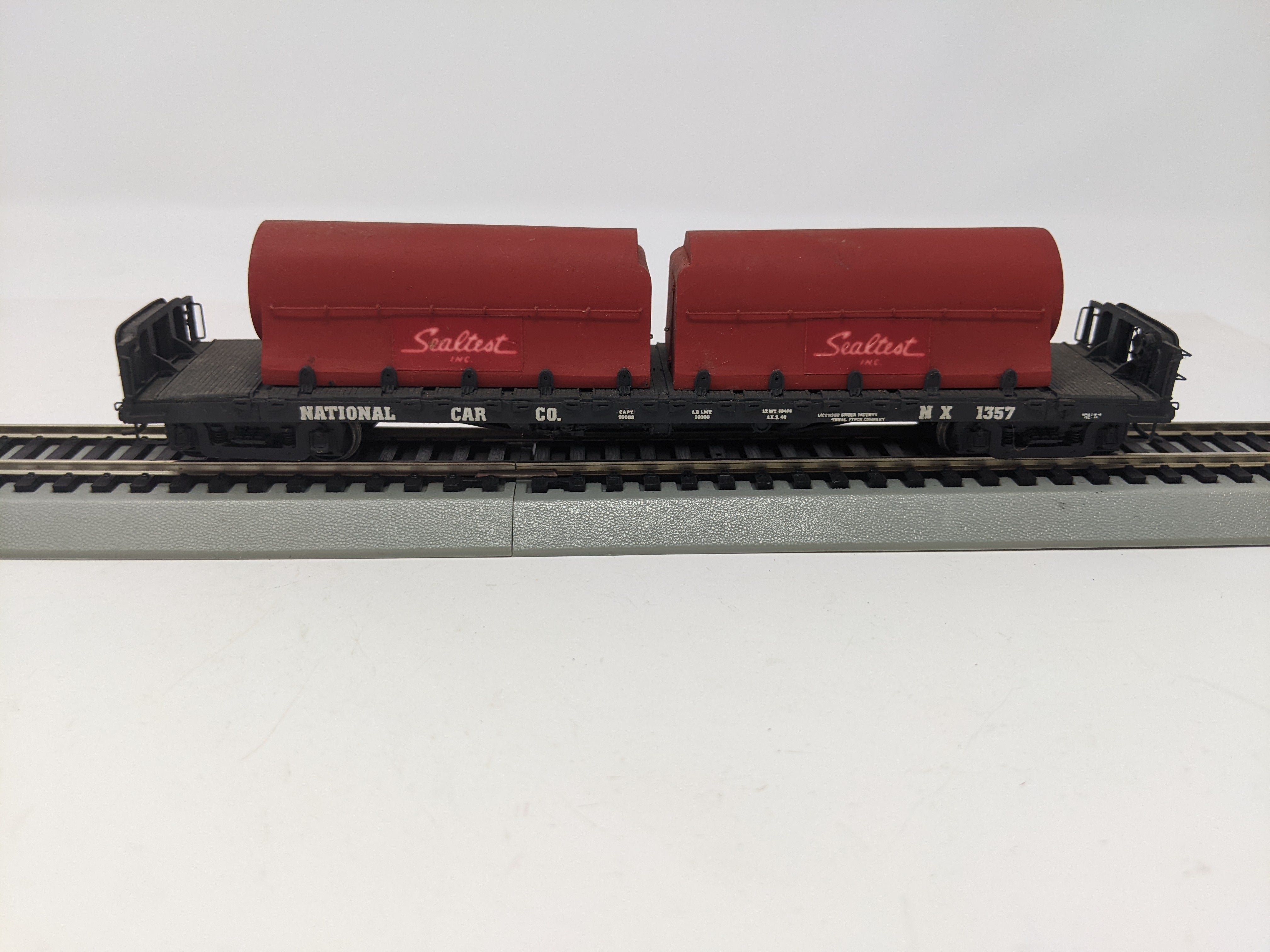 USED HO Scale, 50' Flat Car with 2 Milk Containers, National Car Co NX #1357, Read Description