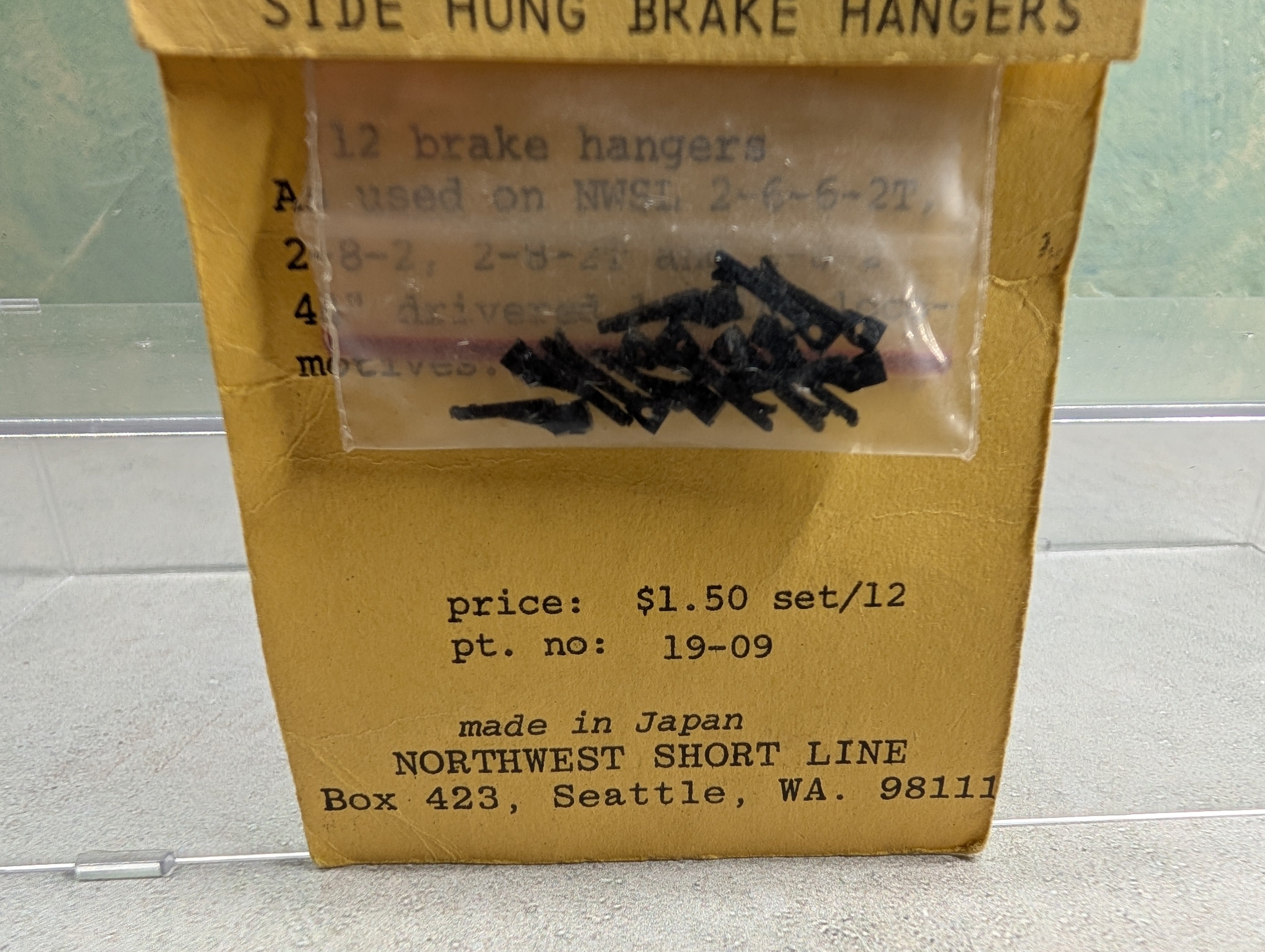 Northwest Short Line #19-09 HO Scale Side Hung Brake Hangers, Black Plastic (12 pcs)