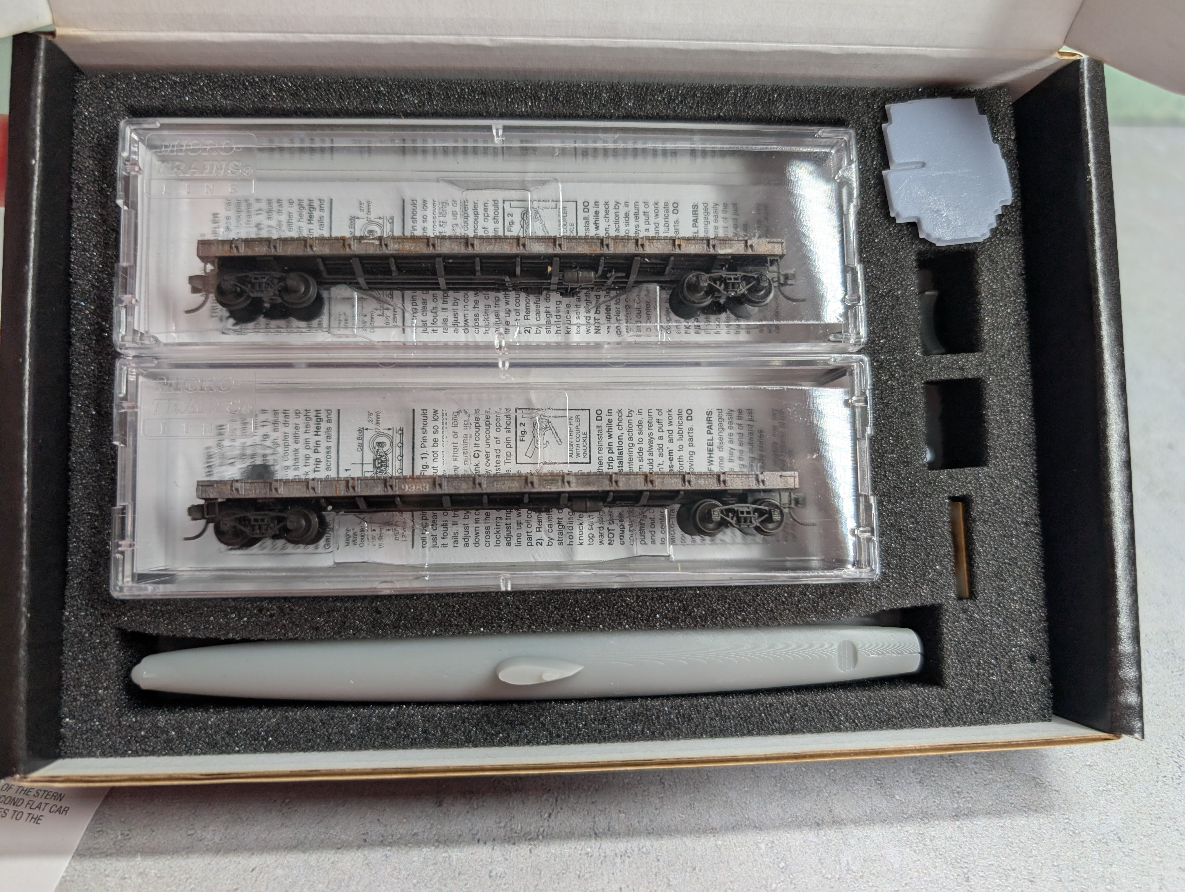 Micro-Trains 98302256 N Scale Weathered Flat Car 2-Pack w/ Captured WW2 HA-19 Load #9872 & 9983