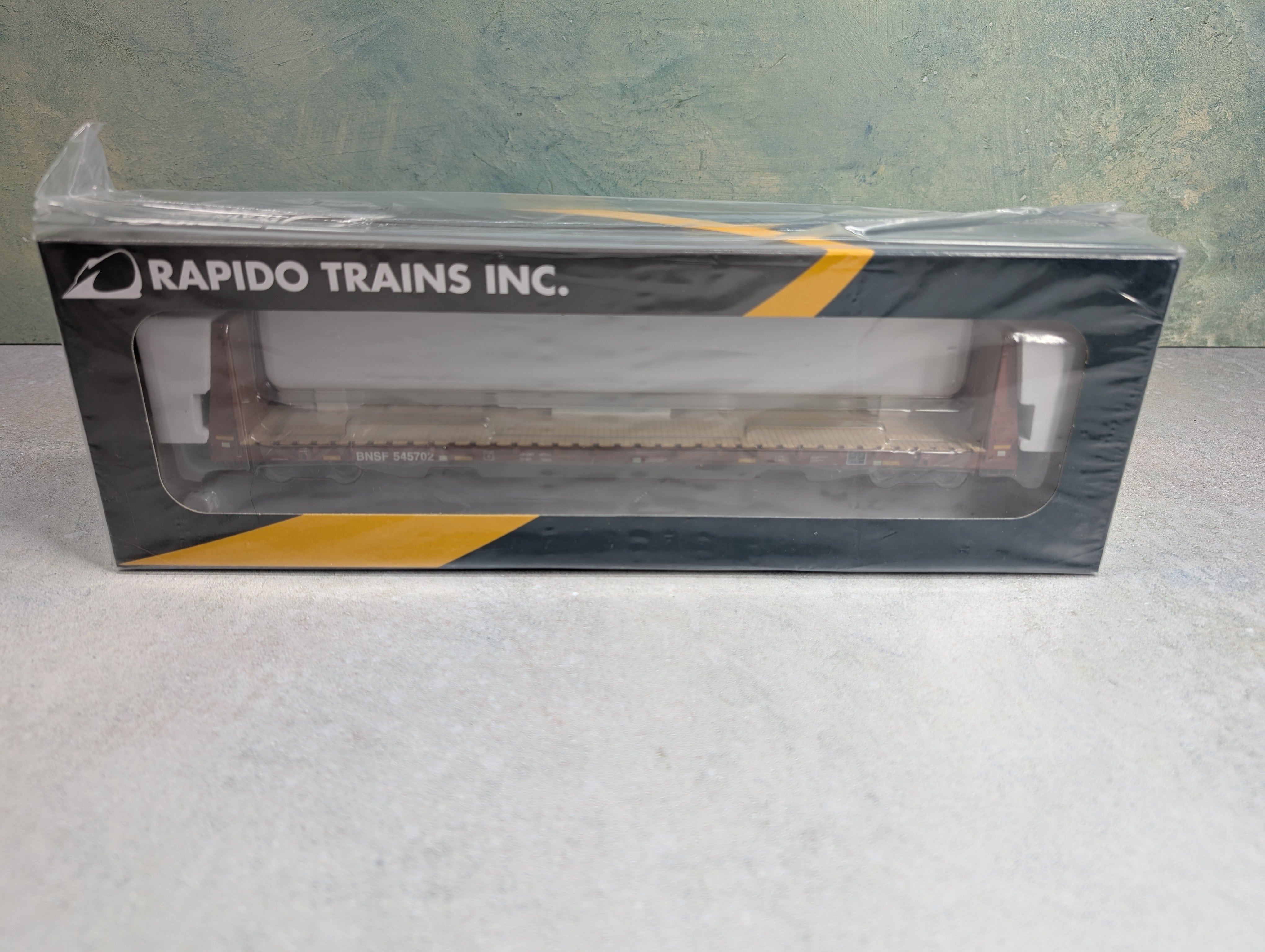 Rapido 147008 HO Scale Bulkhead Flatcar BNSF #545702 Mineral Brown