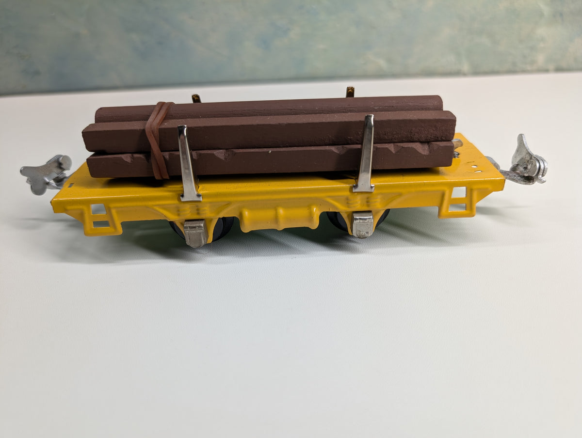 USED Lionel 831 O Flat Cart w/ Lumber Load, Tin Yellow