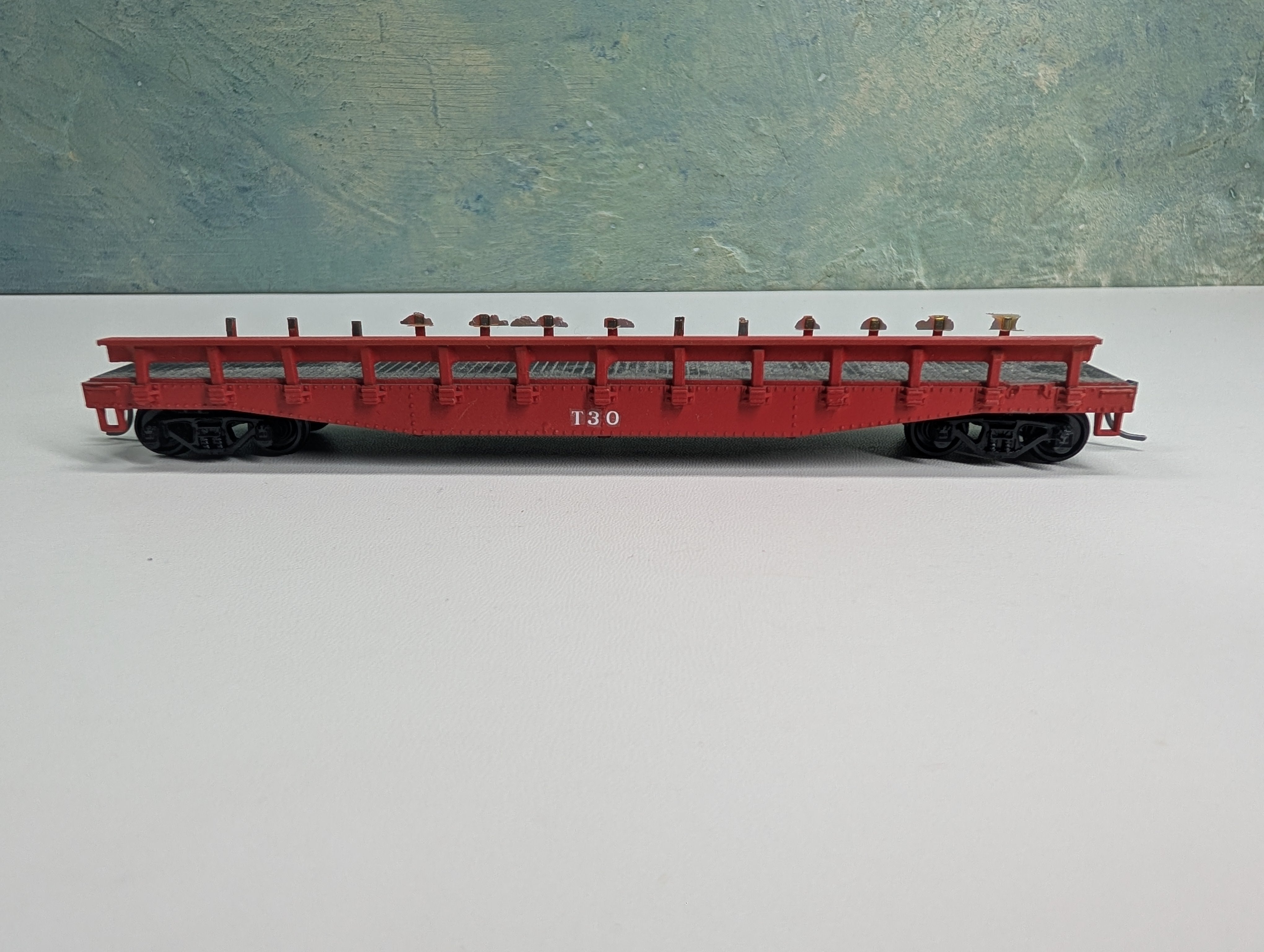 USED Athearn HO Scale Red 50' Flat Car w/ Stakes T30