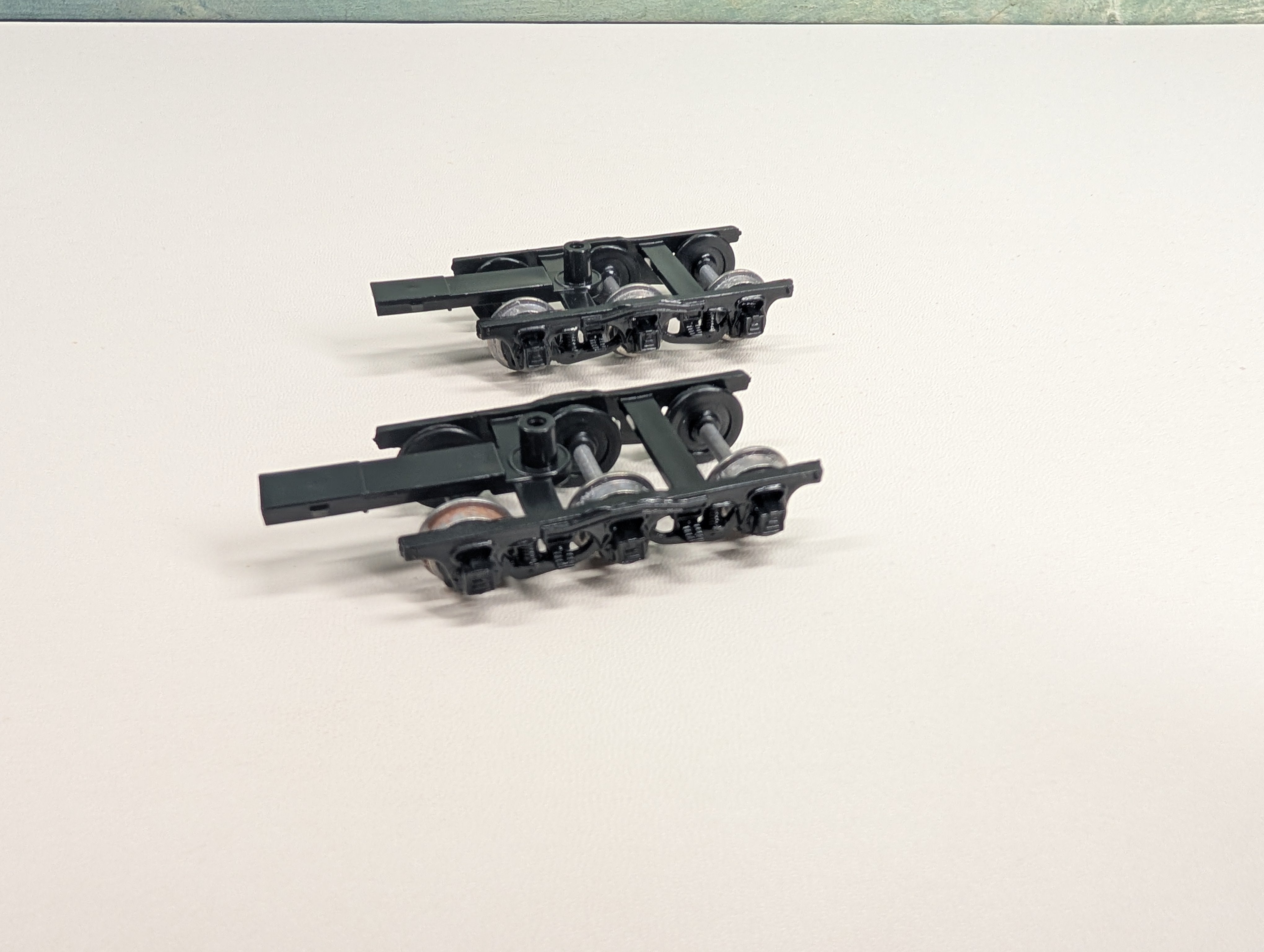 USED HO Scale Pair of Three Axle Passenger Car Trucks
