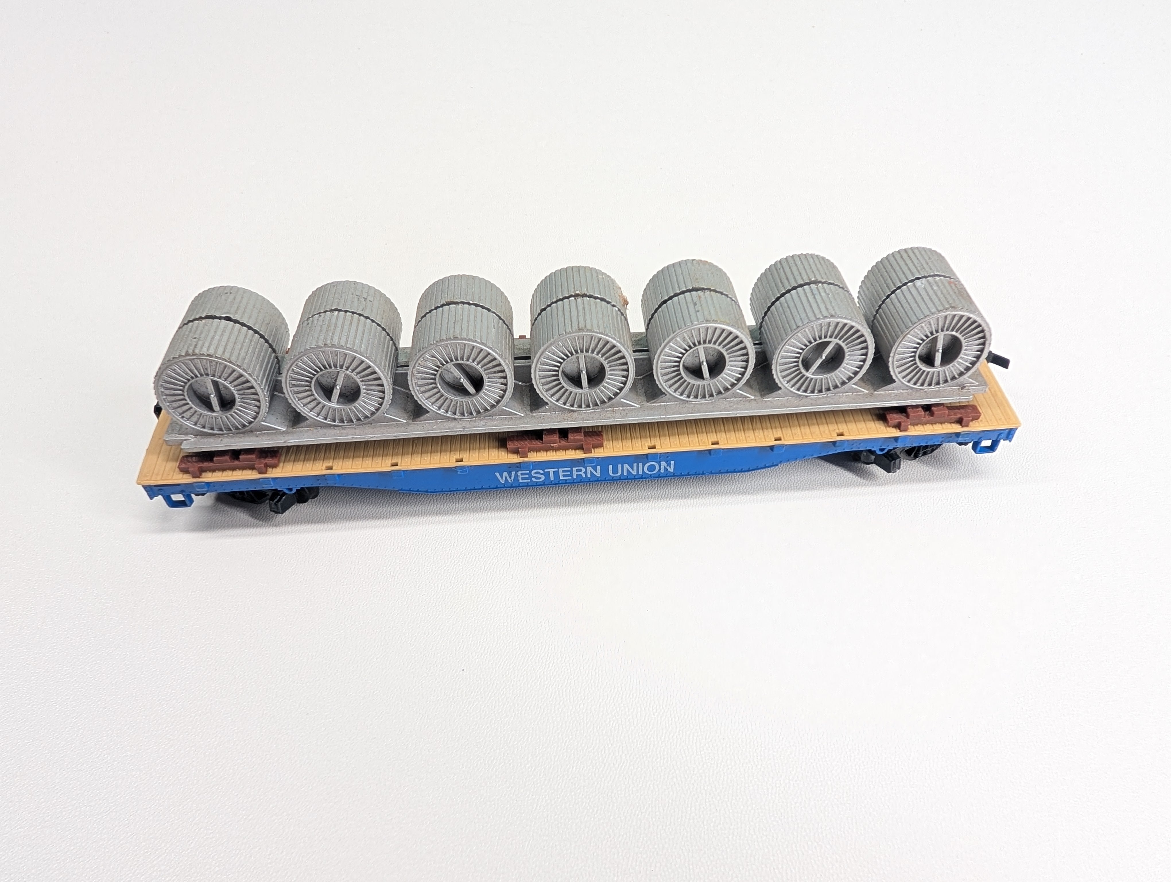 USED Tyco HO Scale 50' Flat Car w/ Coil Load Western Union